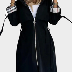 Black coat with front zipper and checked cuffs