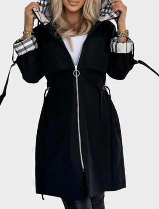 Black coat with front zipper and checked cuffs